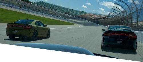 couple of Dodge Charger running on the circuit